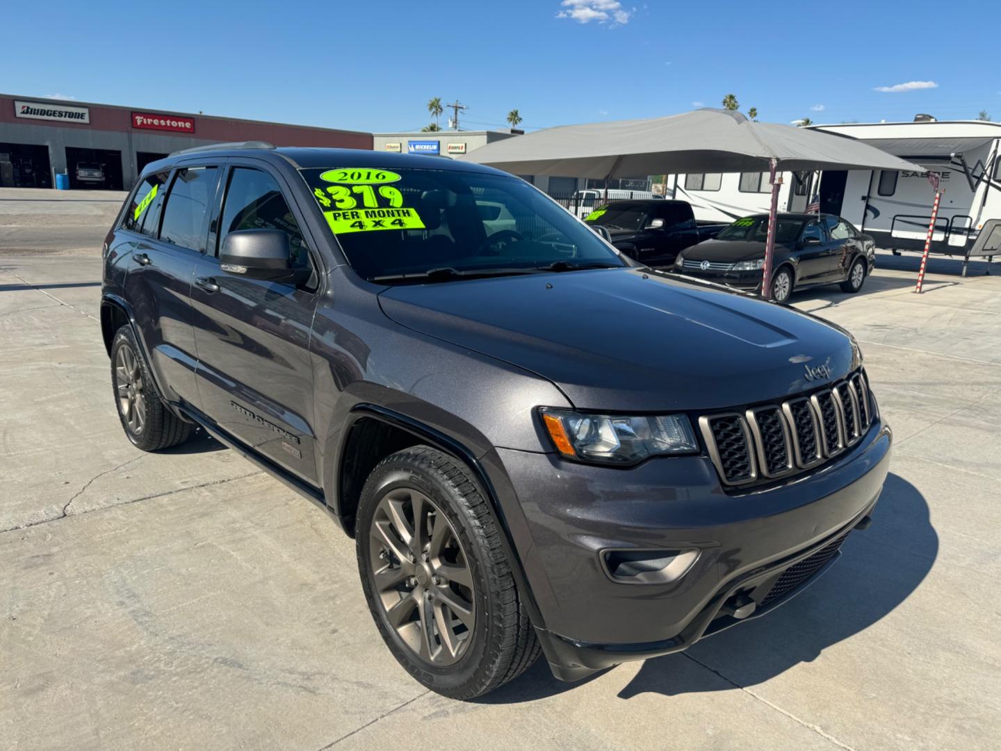 2016 grey Jeep Grand Cherokee (1C4RJFBG0GC) , located at 2190 Hwy 95, Bullhead City, AZ, 86442, (928) 704-0060, 0.000000, 0.000000 - 75th anniversary edition. clean carfax. jeep grand cherokee limited 4 wd. Leather loaded. 81k miles. free and clear title. - Photo#0